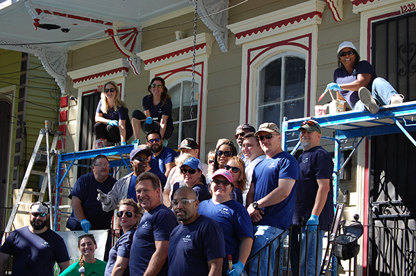 This is a photo of Blue Cross employees working on a house that is being renovated.